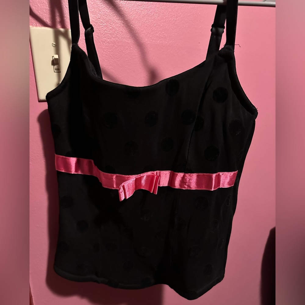 Black polka dot corset with adjustable straps and pink ribbon, size 14/16
